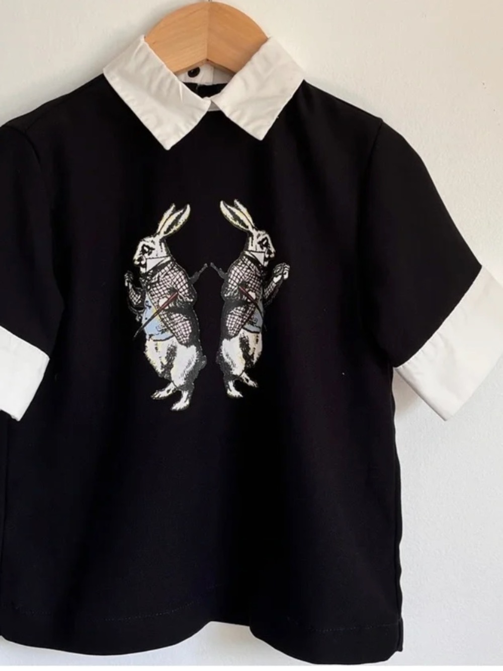 Victoria Beckham Black Tee with White Collar & Bunny from Alice in Wonderland.